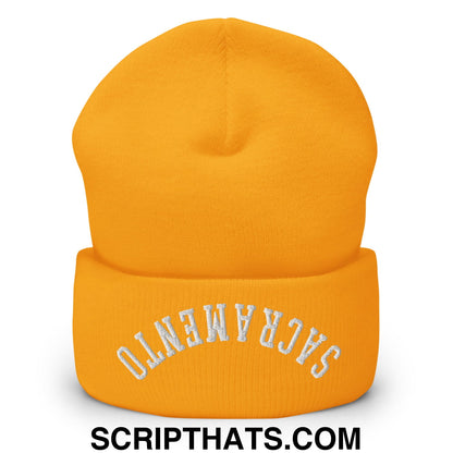 A vibrant orange knit cuffed beanie with white embroidered Sacramento lettering for casual winter wear