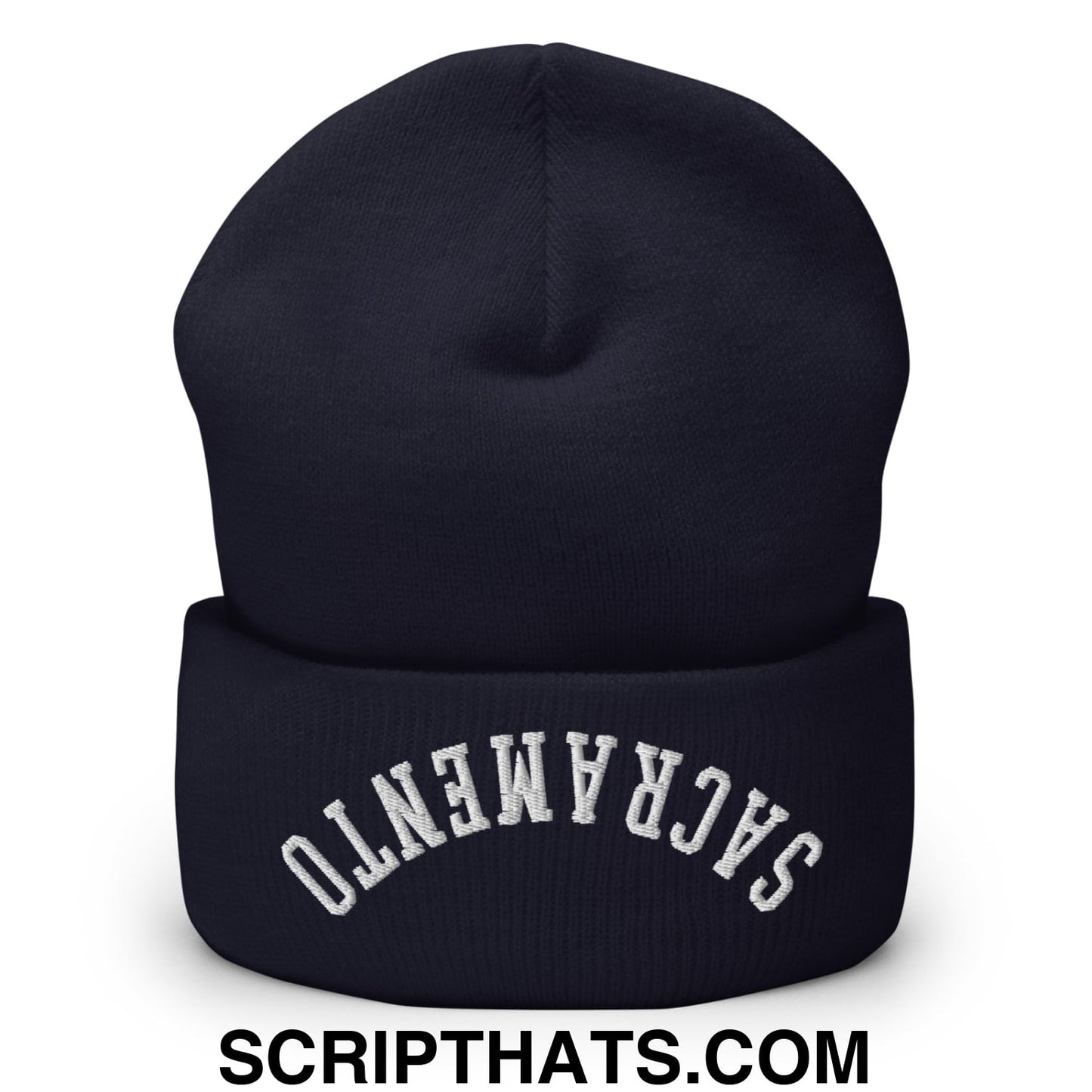 A navy blue knit beanie with a folded cuff and white upside down Sacramento embroidery on the front