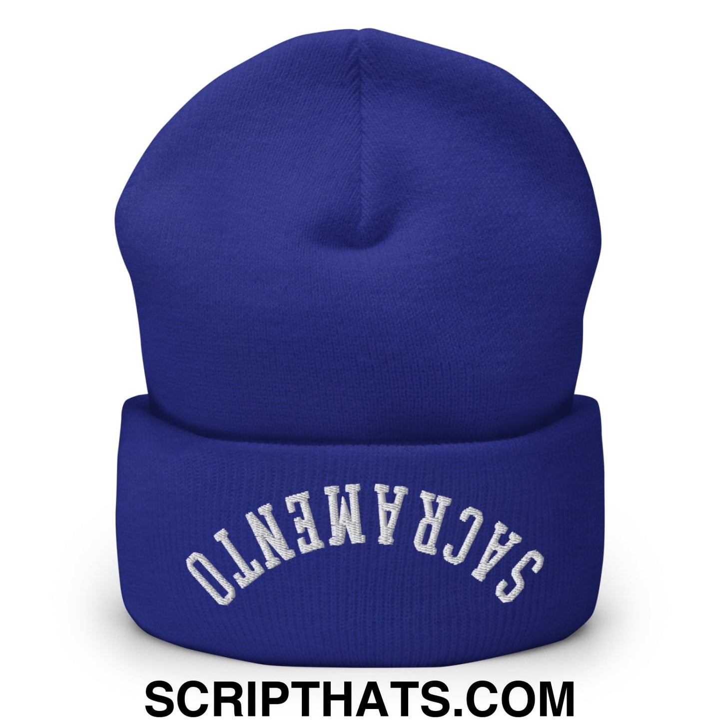 Royal blue knit beanie with white embroidered sacramento on the folded cuff featuring upside down design