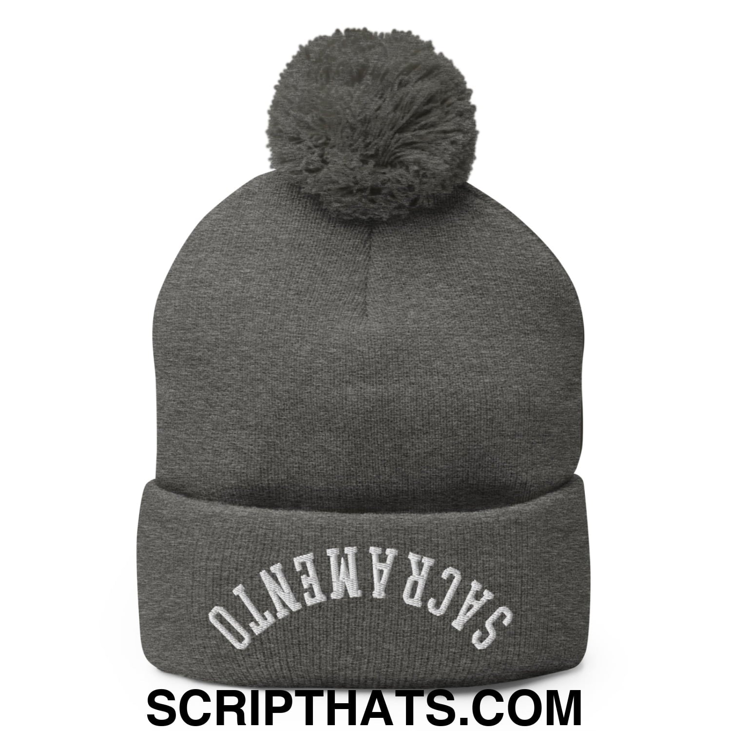 Gray knit beanie with matching fuzzy pom pom and white embroidered sacramento on folded brim in upside down style