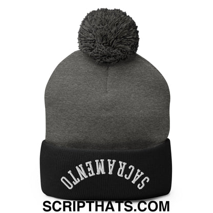 Gray knit beanie with black ribbed cuff featuring white embroidered Sacramento and gray pom pom on top