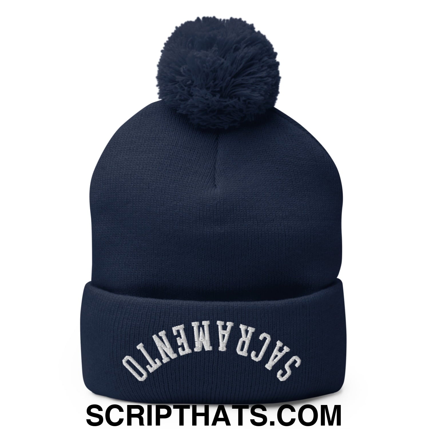Navy blue knit beanie with matching pom pom and white embroidered sacramento arch on cuff in upside down style