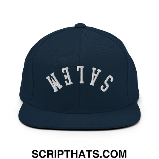 Navy blue flat bill snapback hat with white embroidered salem lettering in an arched design