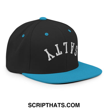 Black snapback hat with teal flat brim and button featuring white salty embroidery on front in arched lettering