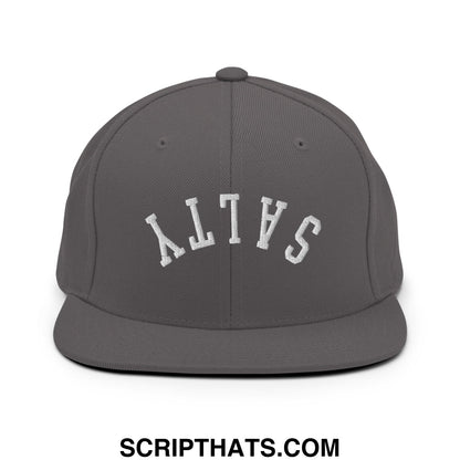 A dark gray snapback hat with a flat bill and white arched salty embroidery on the front