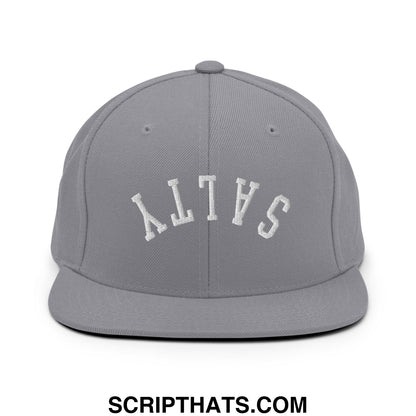 Gray snapback hat with white embroidered salty lettering in an arched design and flat bill brim