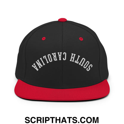 Black and red snapback hat with upside down south carolina embroidery and flat bill brim design