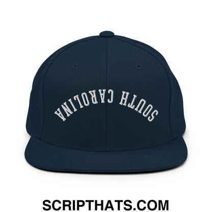 Navy blue flat bill brim snapback hat with white embroidered south carolina lettering in an arched design