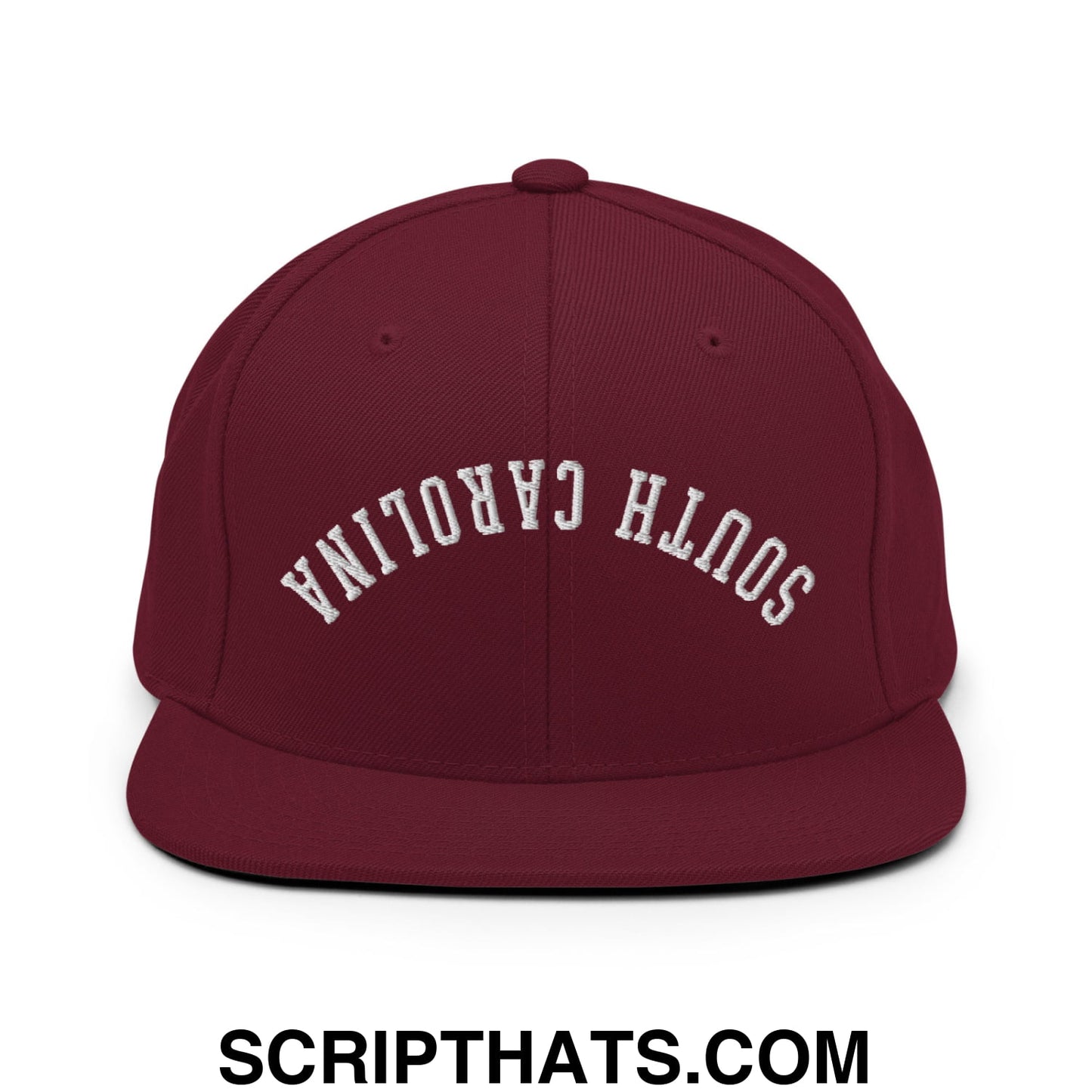 Maroon flat bill brim snapback hat with white embroidered south Carolina lettering in upside down design