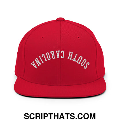 Red snapback cap with white embroidered south carolina text in an arched design and flat bill brim