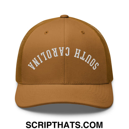 Tan mesh trucker hat with white embroidered south carolina lettering front in upside down design