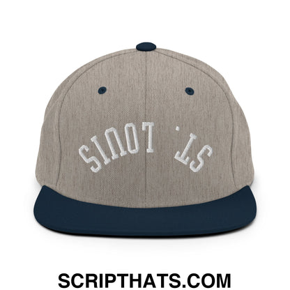 A gray and navy blue snapback hat with upside down st louis embroidered in white on the flat bill brim