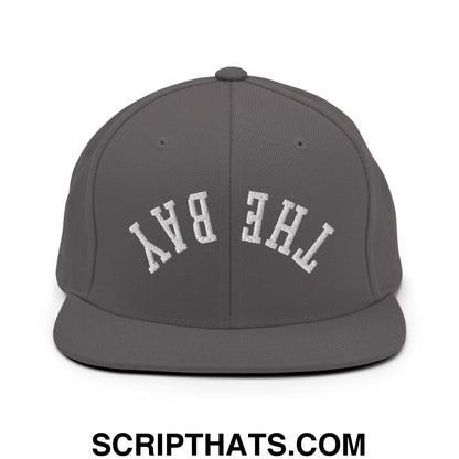 Gray snapback cap with white embroidered the bay lettering in an arched design flat bill brim style