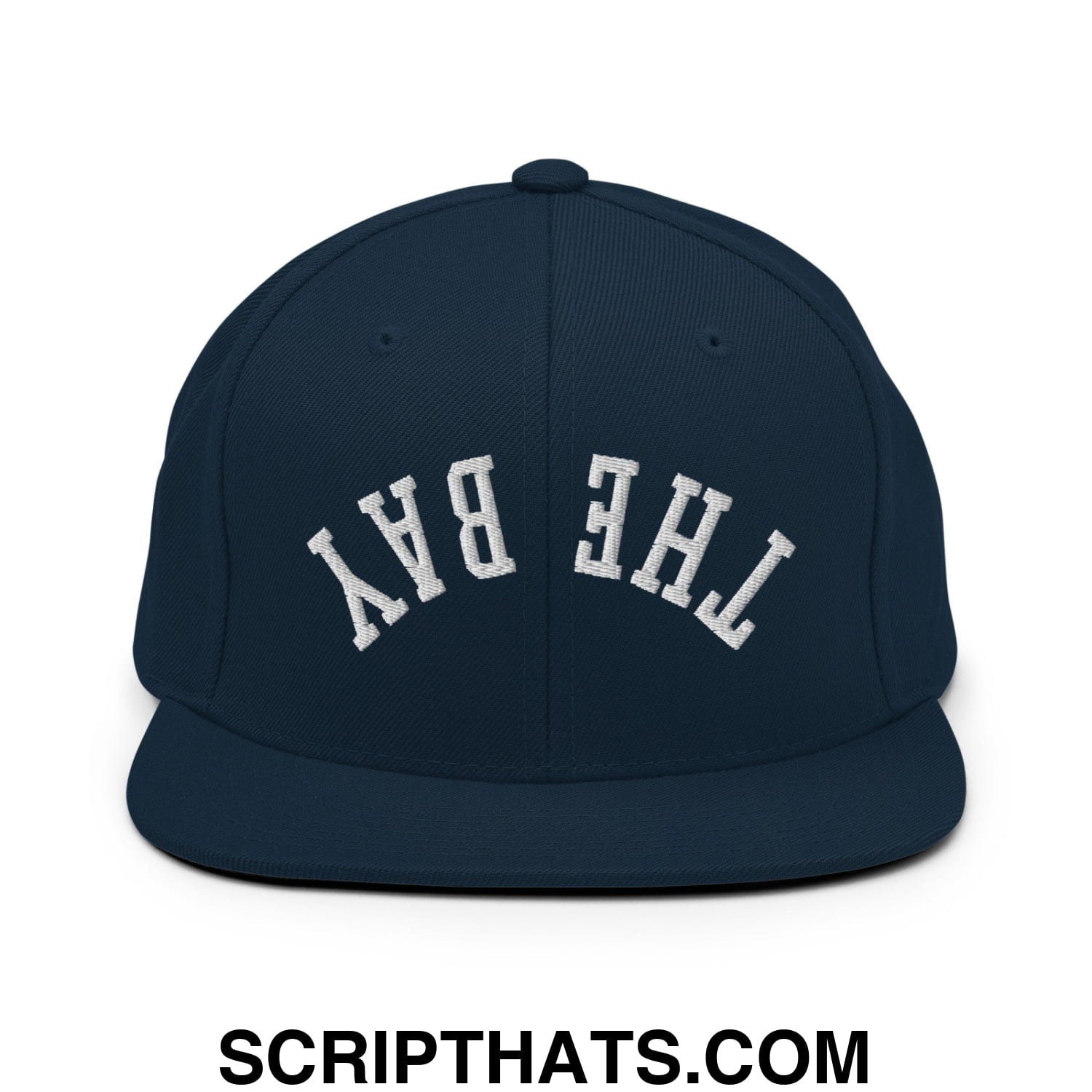 Navy blue snapback hat with white embroidered the bay lettering in classic arched design and flat bill brim