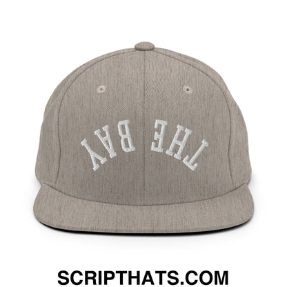 Gray snapback cap with white embroidered the bay lettering and flat bill brim in the Upside Down collection