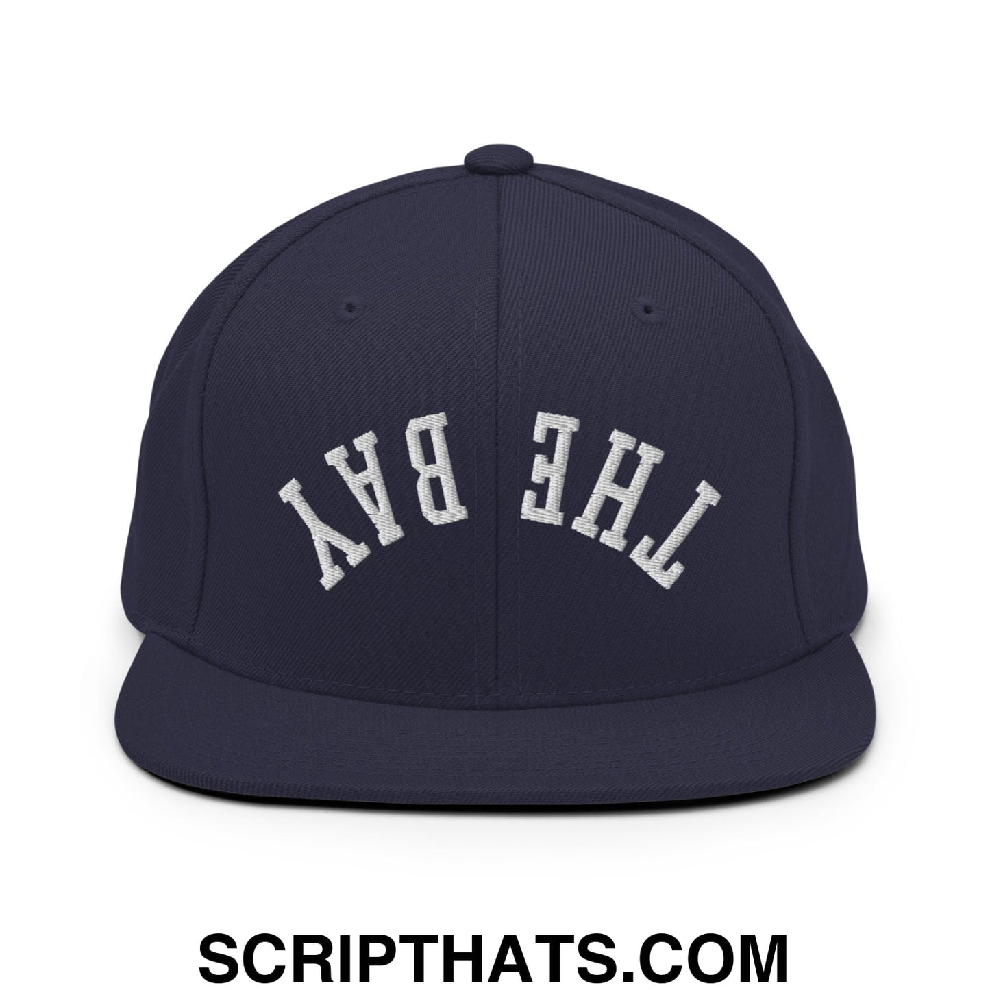 Navy blue snapback hat with white embroidered the bay lettering in a classic arched design flat bill brim