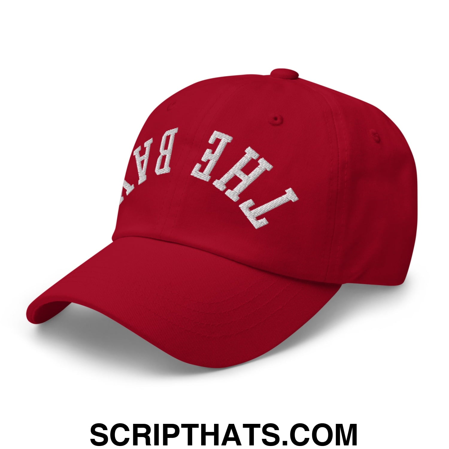 Red unstructured dad hat with white embroidered the bay lettering on front titled upside down the bay embroidered hat