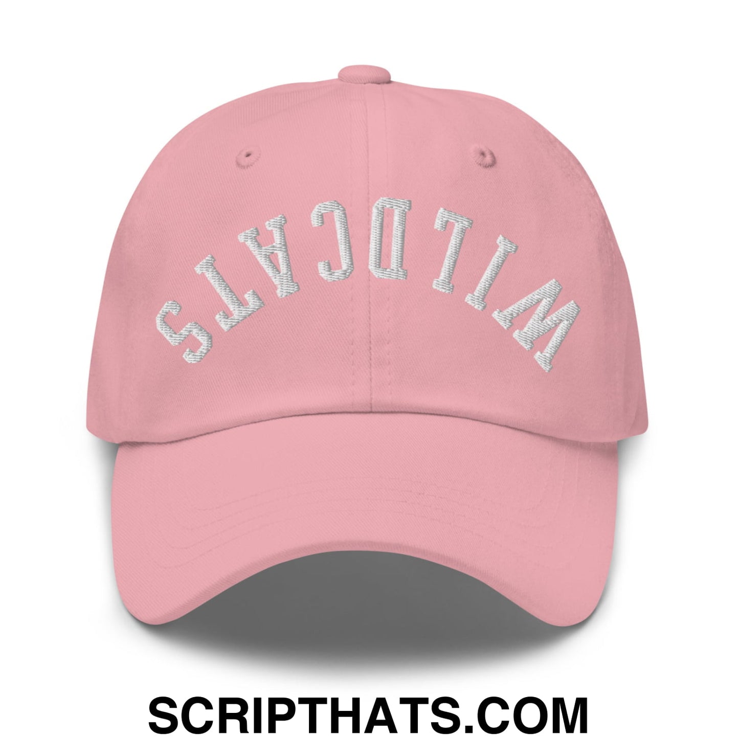 A soft pink unstructured dad hat with wildcats embroidered in silver arched font on the front