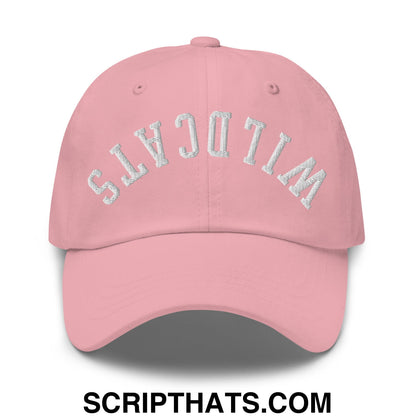 A soft pink unstructured dad hat with wildcats embroidered in silver arched font on the front
