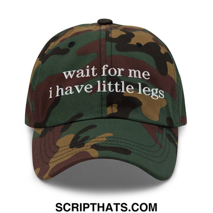 Camouflage-patterned unstructured dad hat with white embroidered wait for me i have little legs text on the front