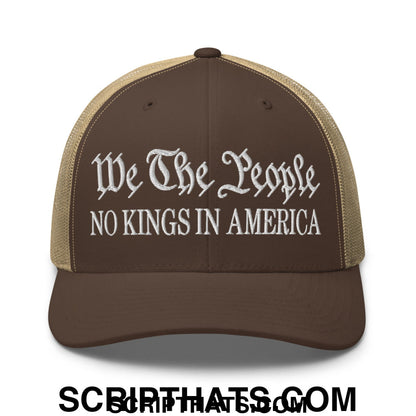 Brown and tan mesh trucker hat with white embroidered we the people no kings in america text in script and block letters
