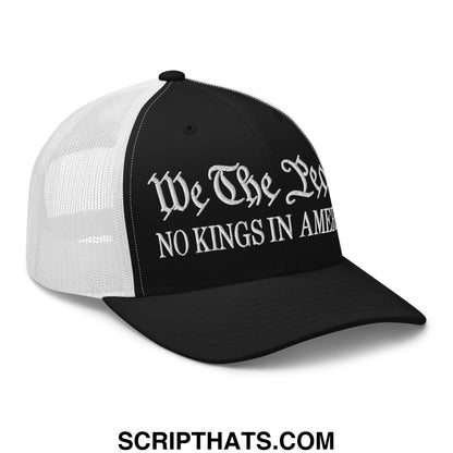 Black and white mesh trucker hat with embroidered gothic script text we the leg no kings in amer on front panel