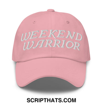 A soft pink unstructured dad hat with weekend warrior embroidered in textured silver thread on the front