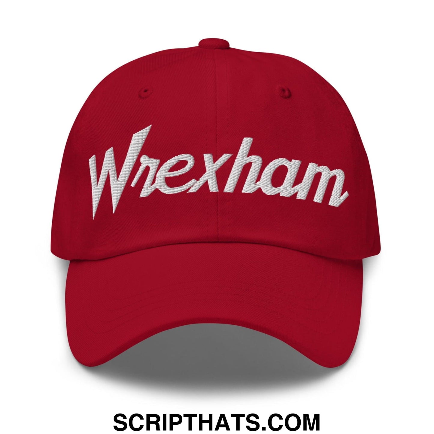 Red baseball dad hat with white embroidered wrexham vintage sports script on the front panel