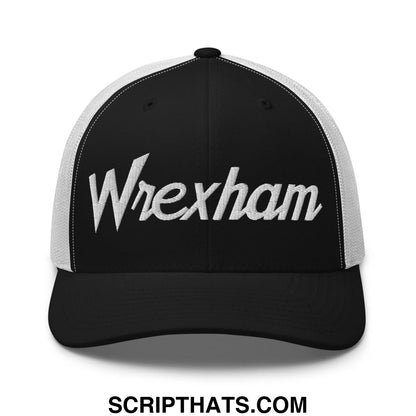 Black and white trucker hat with wrexham embroidered in silver thread in a vintage sports script style