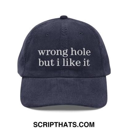 Navy blue corduroy unstructured dad hat with white embroidered text reading wrong hole but i like it