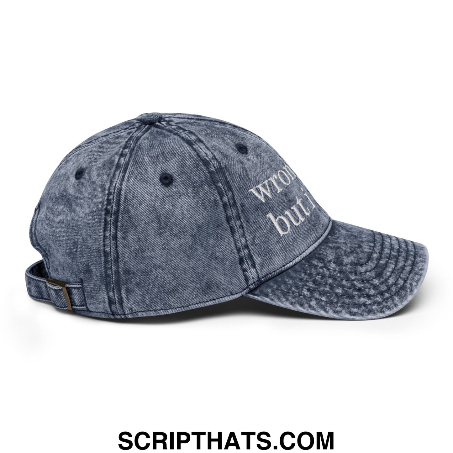 Faded blue denim dad hat with white embroidered text reading wrong but i on the front unstructured design