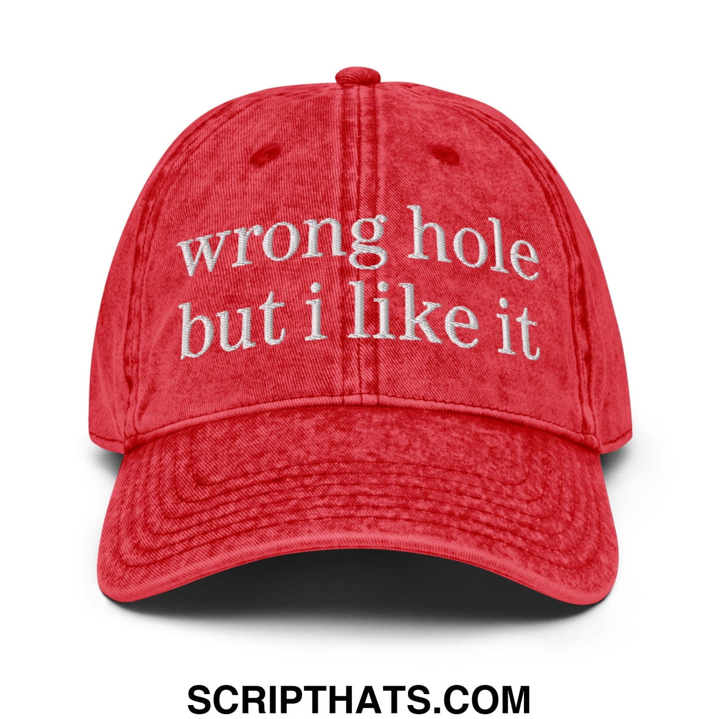 A red distressed cotton baseball cap with white embroidered text wrong hole but i like it from wrong hole but i like it dad hat