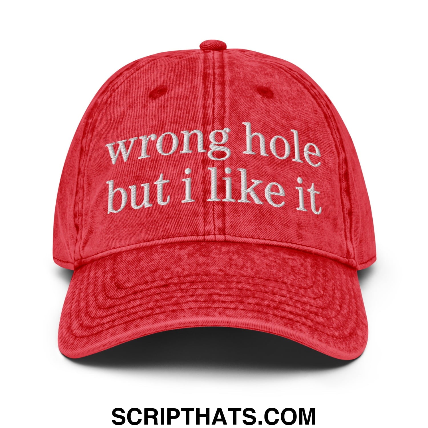 A red distressed cotton baseball cap with white embroidered text wrong hole but i like it from wrong hole but i like it dad hat